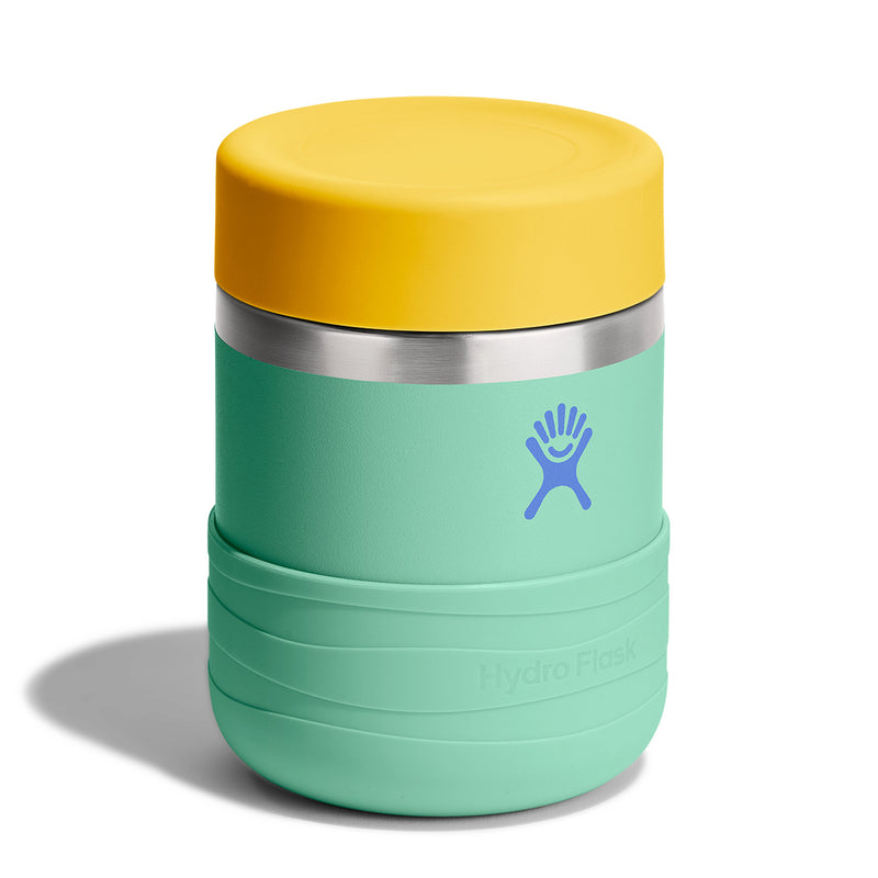 A Hydro Flask insulated container with a mint green body, a yellow lid, and a silver stainless steel band, shown on a white background.