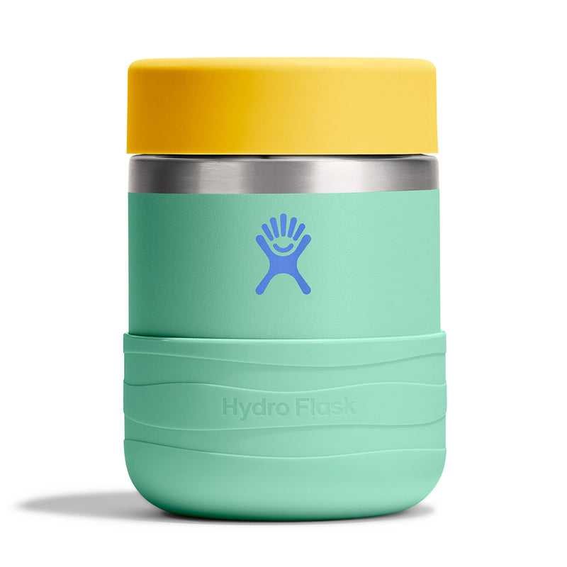 A Hydro Flask insulated tumbler with a mint green body, a bright yellow lid, and a blue Hydro Flask logo on the front, set against a plain white background.