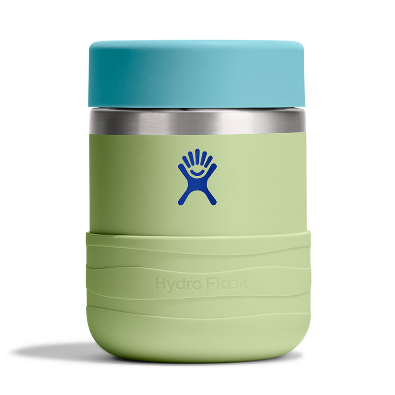 A Hydro Flask insulated tumbler with a light green body, a blue lid, and a blue Hydro Flask logo on the front, set against a plain white background.