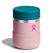 A pink Hydro Flask insulated tumbler with a teal lid and a pink logo on the front, set against a plain white background.