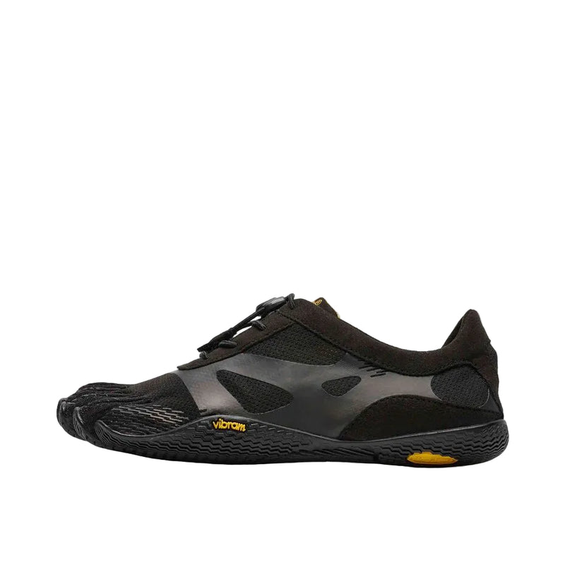 Side view of a black and yellow climbing shoe against a white background. 