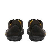 Back view of a pair of black and yellow climbing shoes against a white background. 