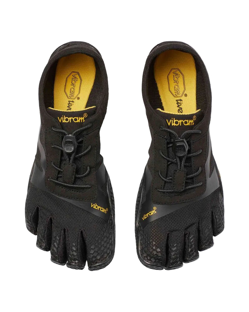 Top-down view of a pair of black and yellow Vibram 5-Fingers against a white background. 