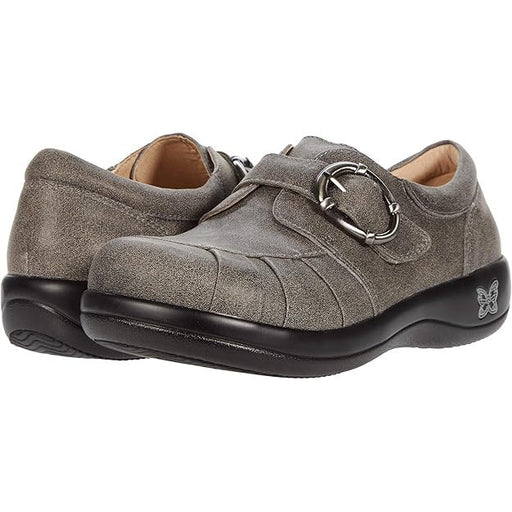 Pair of gray suede shoes with a buckle on a white background