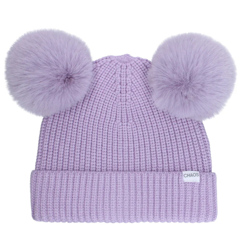 Purple kid's pom pom beanie against a white background. 