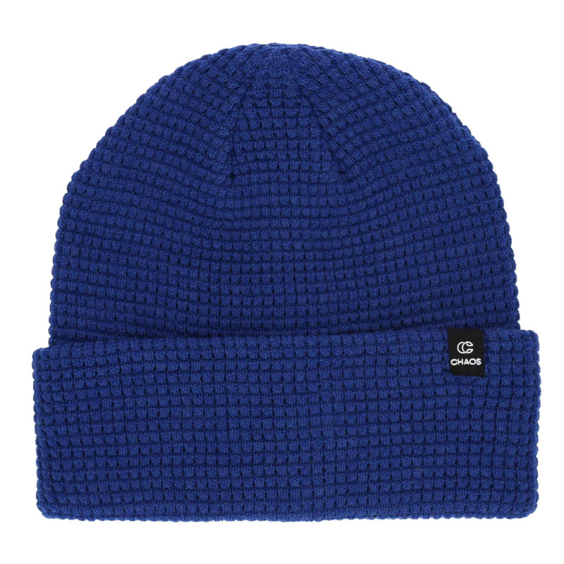 Blue cuffed beanie against a white background. 