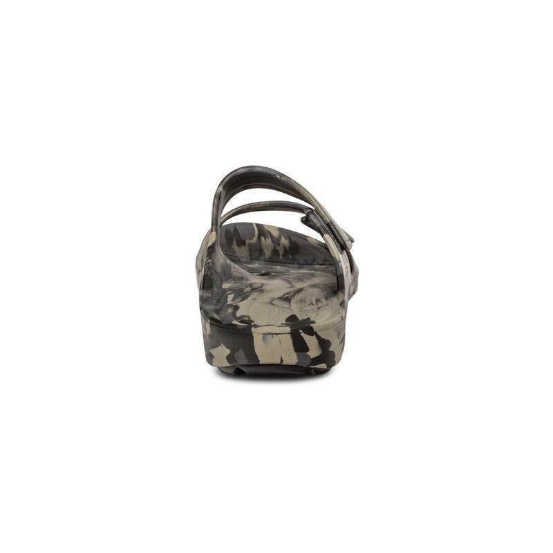 The back of a camouflage sandal with 2 straps on a white background