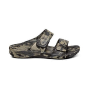 The side of a camouflage sandal with 2 straps on a white background