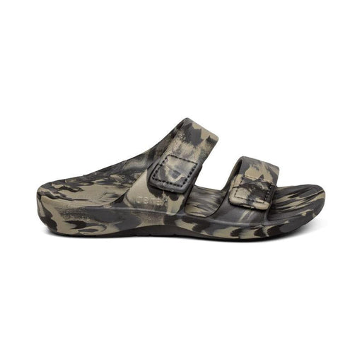 The side of a camouflage sandal with 2 straps on a white background