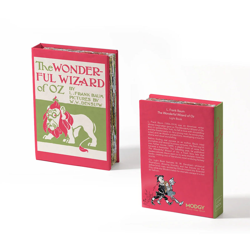 A hardcover light book of 'The Wonderful Wizard of Oz' shown from the front and back. The cover features a red top half with the title in green and pink, a green bottom half with a white lion illustration, and a white spine.