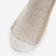 Close-up of a beige and white sock on a light gray background