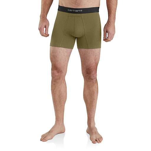 A person wearing a pair of green boxers on a white background