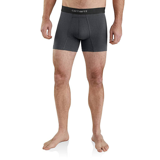 A man wearing dark gray Carhartt athletic boxer briefs, shown from the waist down against a plain white background.