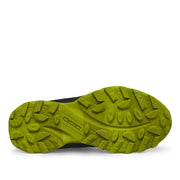 Green sole of a shoe on a white background