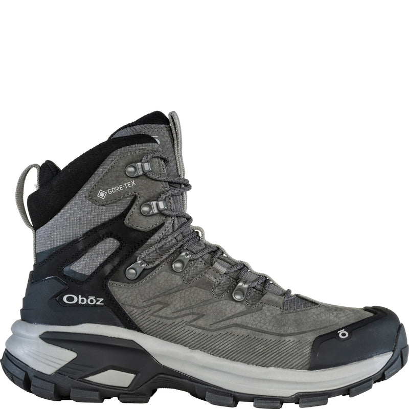 A gray hiking boot with black details on a white background
