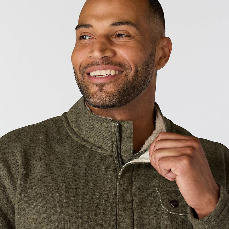 Happy man wearing an olive color fleece jacket with chest pocket on a white backrgound