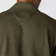 Back of a man wearing an olive colored fleece jacket on a white background