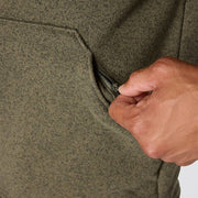 Pocket being unzipped on an olive colored fleece jacket