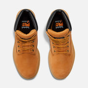 Pair of tan leather boots with orange laces on a white background