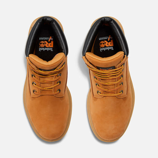 Pair of tan leather boots with orange laces on a white background