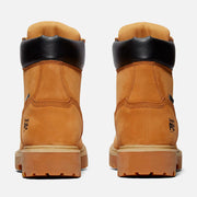A pair of Timberland 6-inch work boots shown from the back, featuring a tan suede upper, black leather collar, and tan rubber sole on a light gray background.