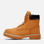 Tan boot with black top on a white background