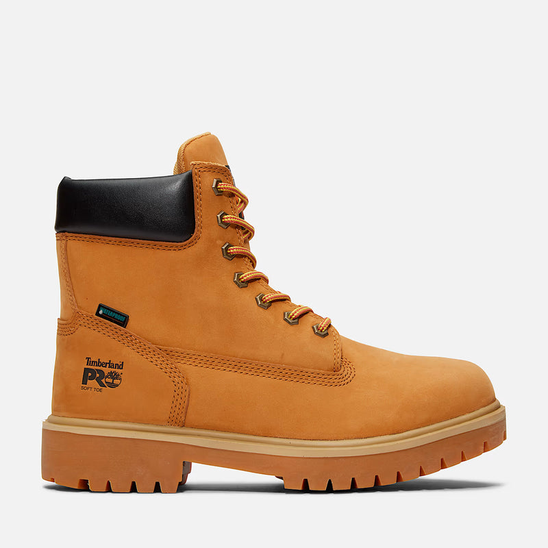 Yellow work boot with black sole on a white background