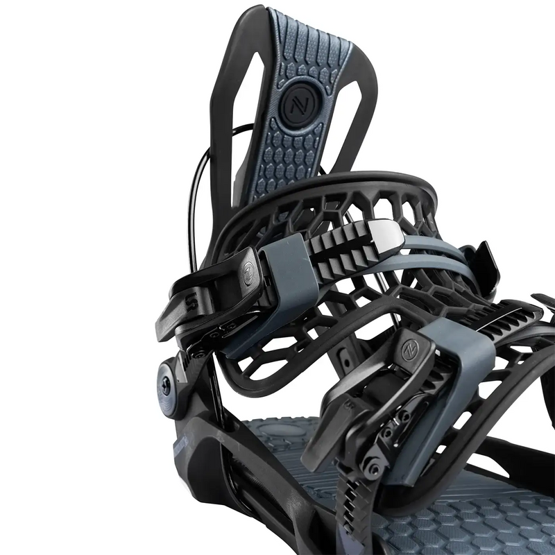 Black and grey colored snowboard bindings against a white background. 