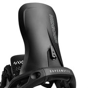 Close up back view of a black snowboard binding against a white background. 