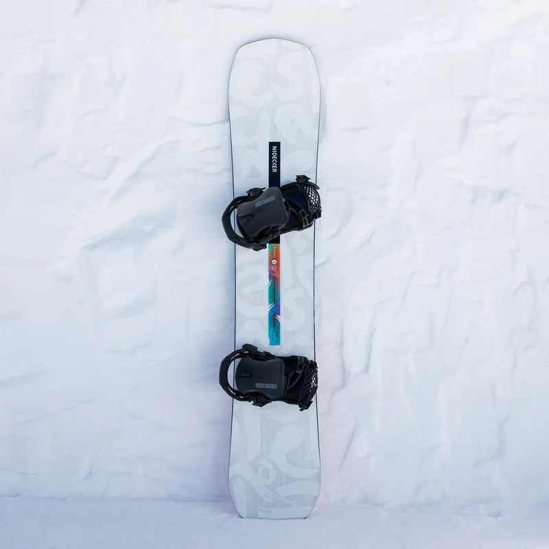 White snowboard with black bindings and a Nidecker logo against a snowy background.