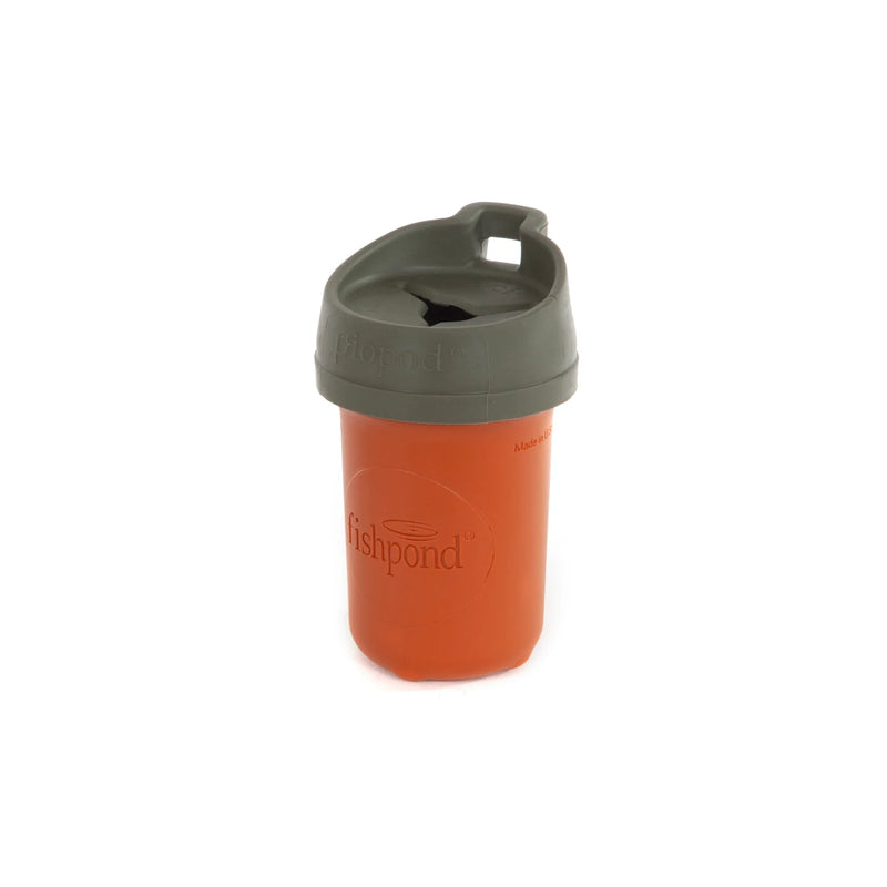 An orange container with a gray lid on a white background