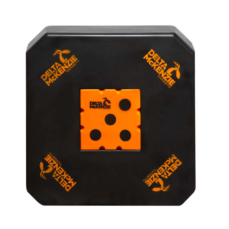 A black square foam training target with rounded corners, featuring an orange square target in the center with five holes, and orange Delta McKenzie logos printed on the black surface.