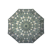 An umbrella with a blue and green floral pattern on a white background