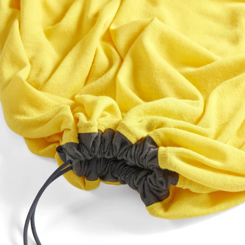 Yellow drawstring sleeping bag liner with a black drawstring on a white background