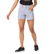 Person wearing patterned shorts on a plain background