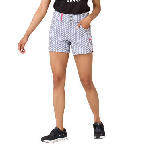 Person wearing patterned shorts on a plain background