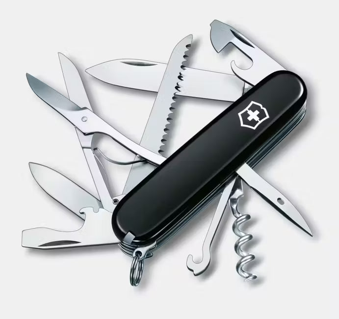 Multitool with various tools on a white background