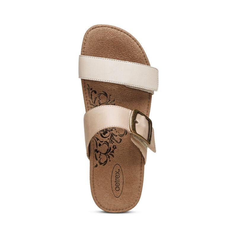 The top view of a brown cork sandal with 2 gray straps on a white background