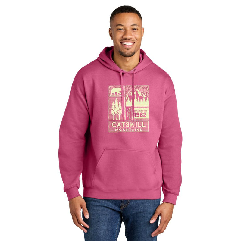 Man wearing a pink hoodie with 'Catskill Mountains' design on a white background