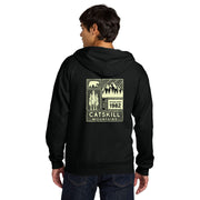 Person wearing a black hoodie with a graphic design on the back, set against a white background