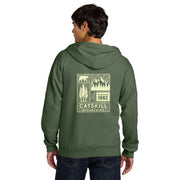 Person wearing a green hoodie with 'Catskill Mountains' design on the back