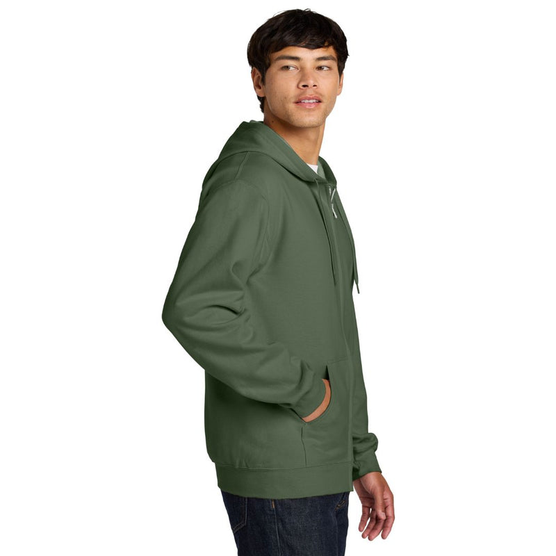 Person wearing a green hoodie on a white background
