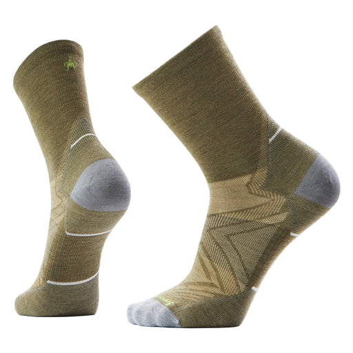 Pair of green socks with gray toes on a light gray background