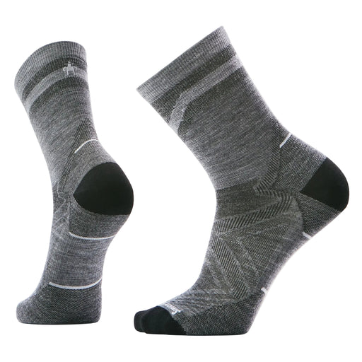 Pair of gray socks with black accents on a light gray background