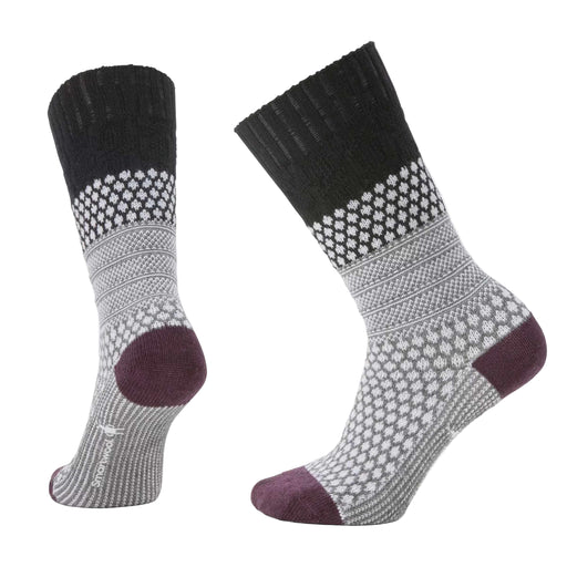 Pair of black, gray, and purple patterned socks on a light gray background