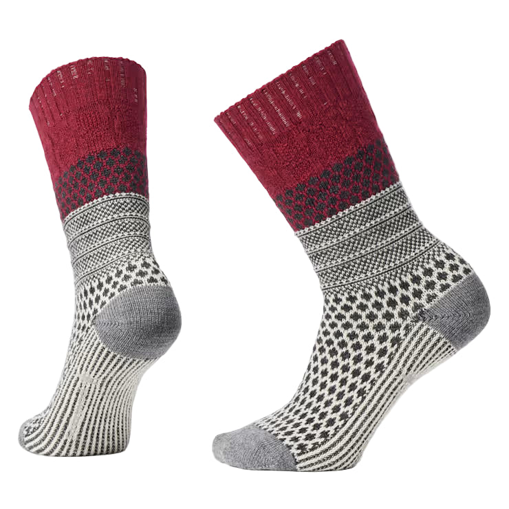 Pair of red and gray patterned socks on a light gray background