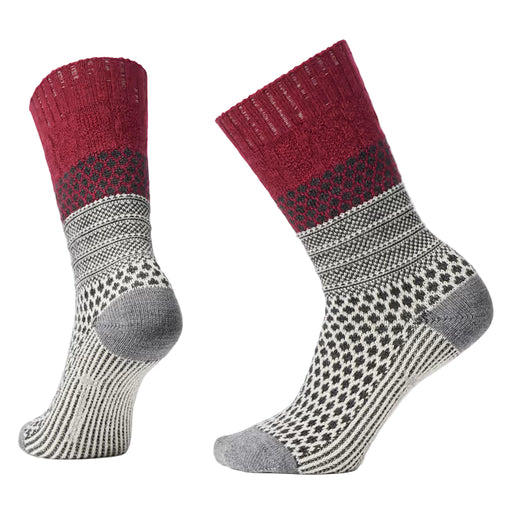 Pair of red and gray patterned socks on a light gray background