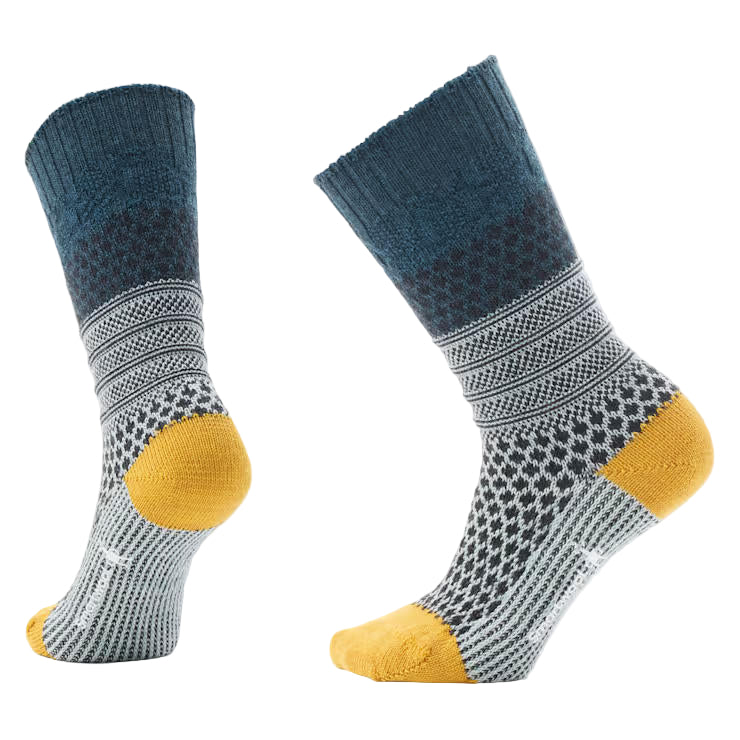Pair of socks with blue, gray, and yellow pattern on a light gray background