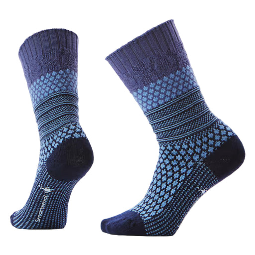 Pair of blue and purple patterned socks on a light gray background