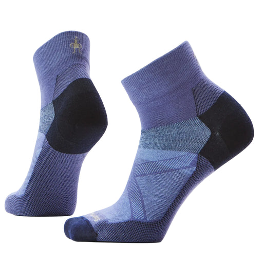 Pair of blue and black socks on a light gray background